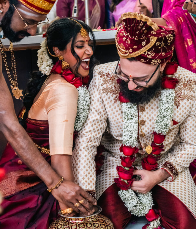 A man and woman are holding hands while standing.