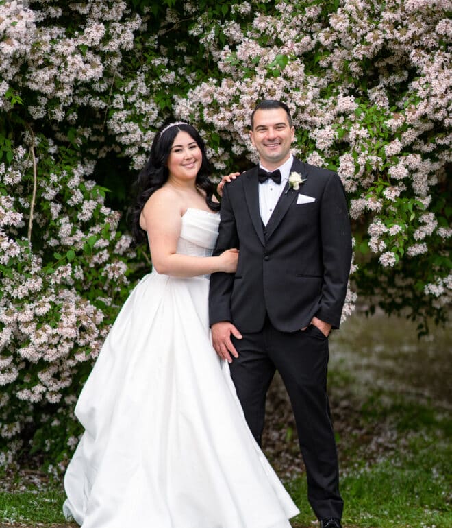 bride and groom posing for a wedding photographer