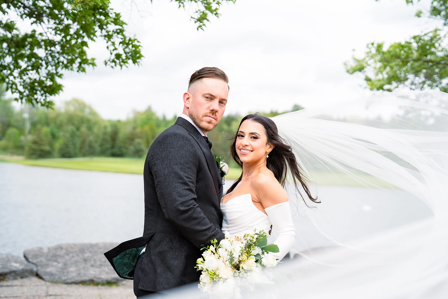 bride and groom by water
