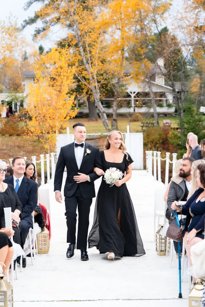 groomsman and bridesmaid walking down aisle