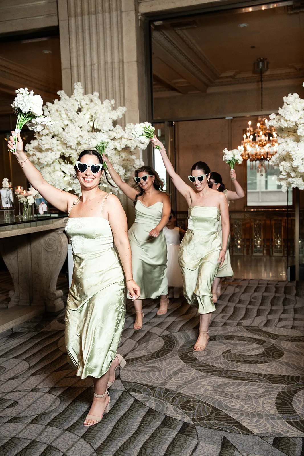 bridesmaids entering reception at one king west hotel