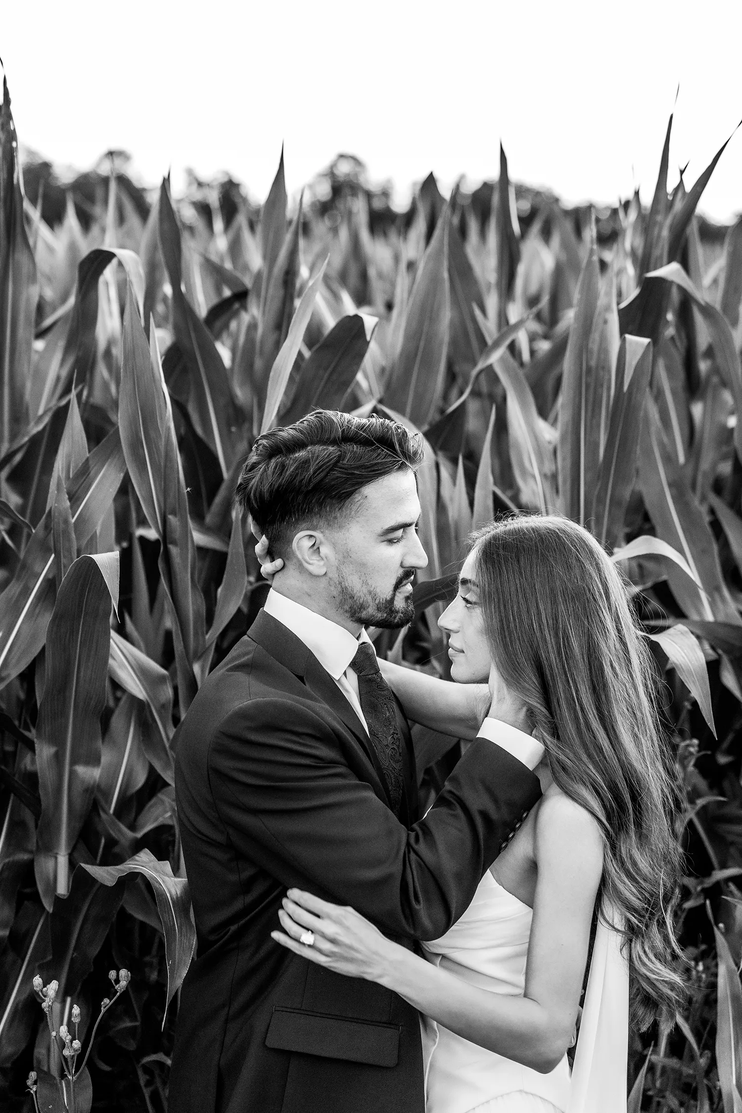 Candid black and white portrait of bride and groom
